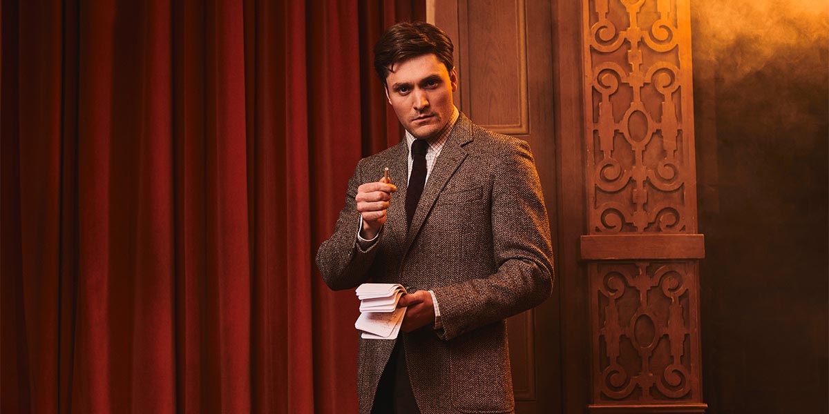 A scene from "The Mousetrap" featuring actors on stage, with dramatic lighting and period costumes.