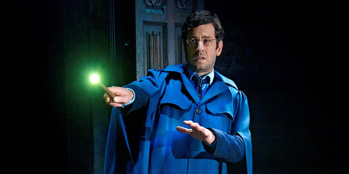 David Ricardo-Pearce as a character from Harry Potter, wearing a costume, with a theatrical backdrop.