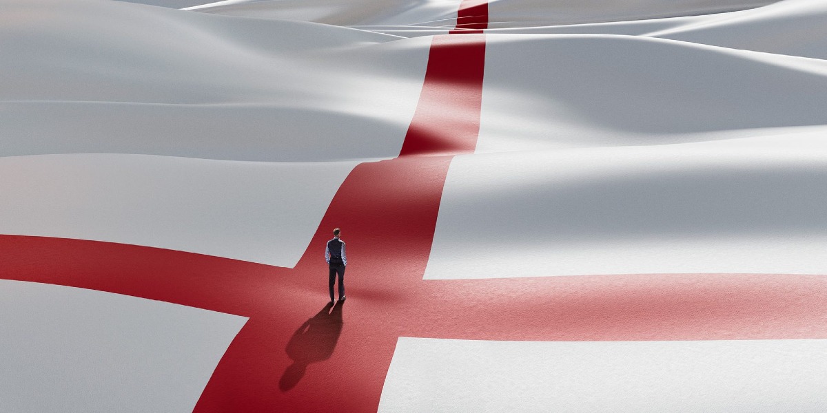 The England flag with a man standing in the centre.