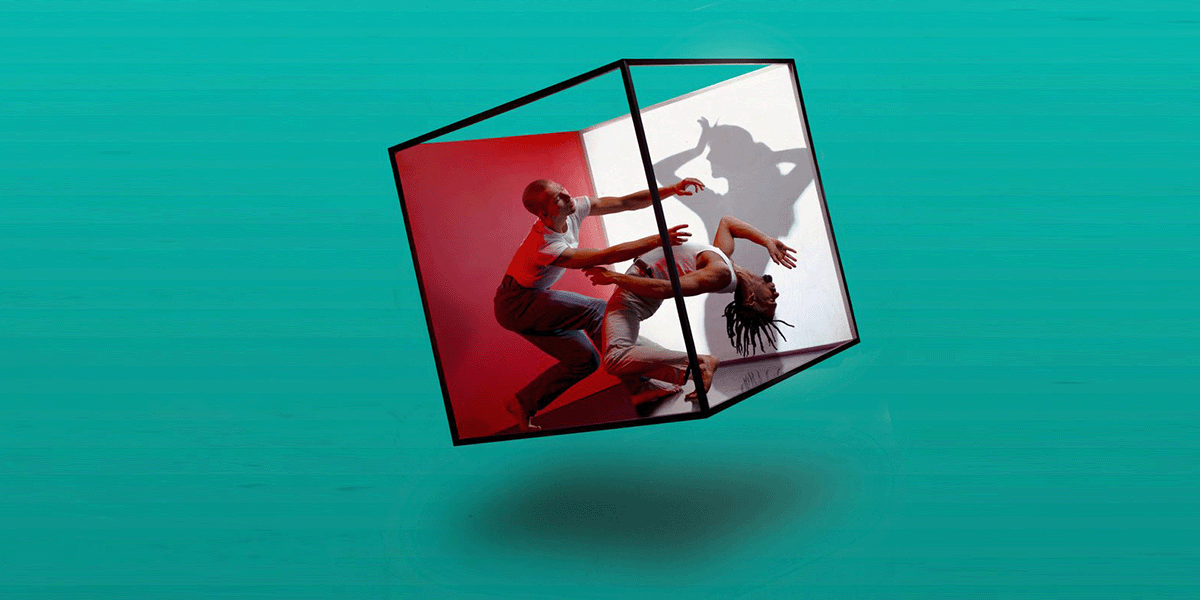 Two people dancing in a cube.