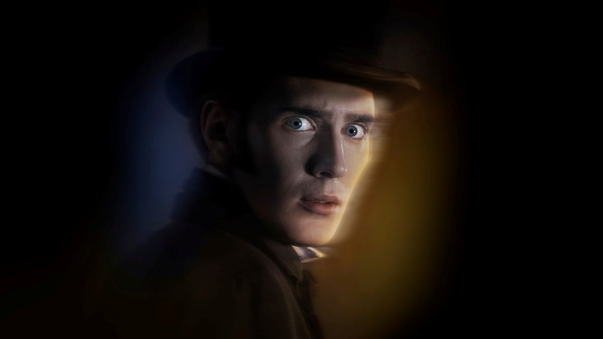 There is a black background. In the centre of the image is the head and shoulders of a man, wearing a black top hat and suit. He has a look of fear on his face. The image is slightly smeared.