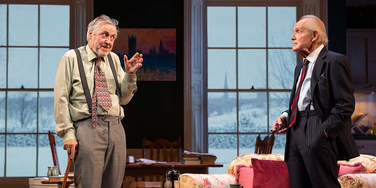 A woman in a blue dress stands at a podium, addressing a crowd with a serious expression.