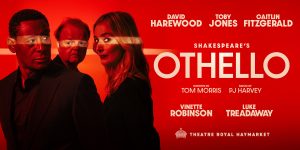 A dramatic stage scene from Othello, featuring actors in period costumes against a dark, moody backdrop.