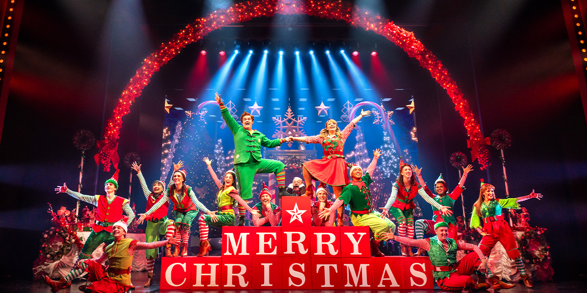 Joel Montague as Buddy and Carrie Hope Fletcher as Jovie centre stage with the cast in ELF the Musical.