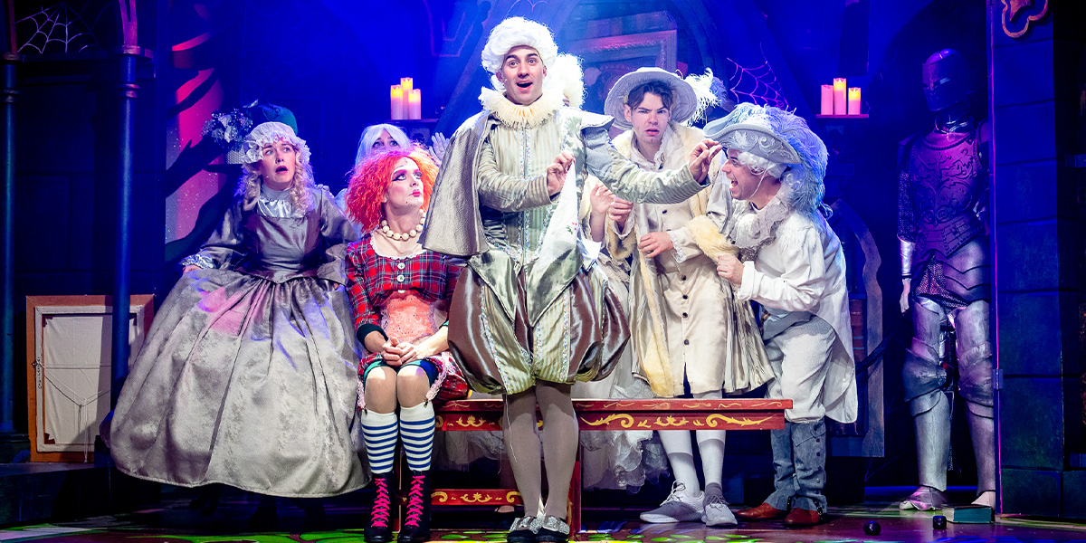 A scene from "Beauty and the Beast" featuring Belle in a yellow gown, surrounded by enchanted objects.