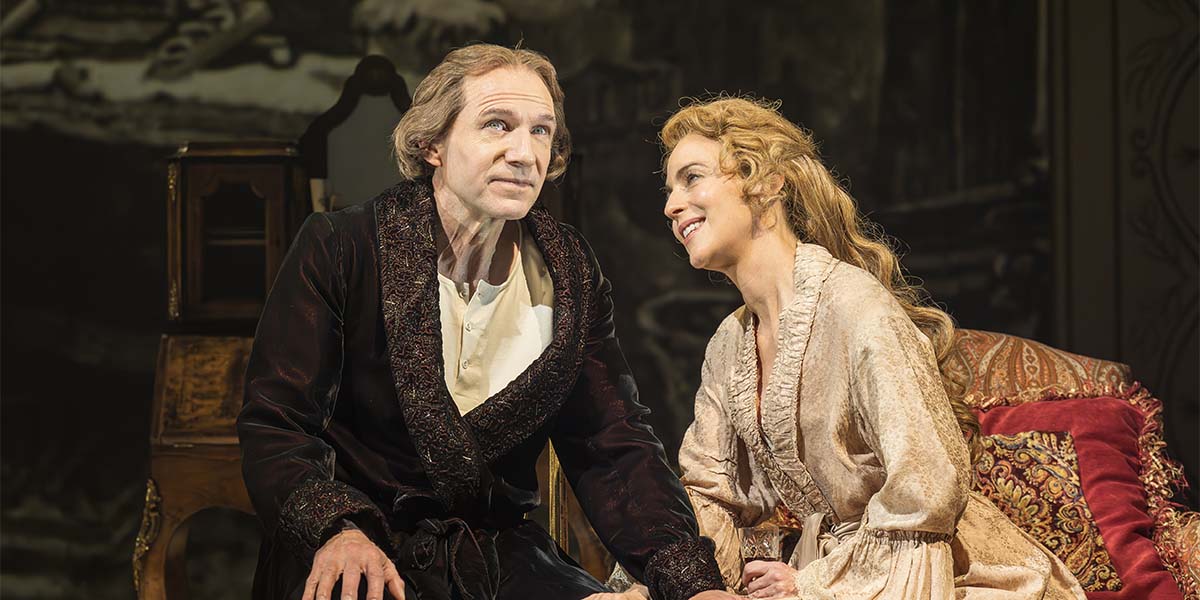 Ralph Fiennes as Henry Irving and Miranda Raison as Ellen Terry in period costumes on stage.