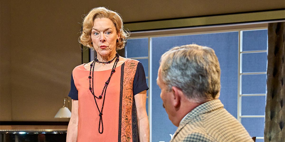 Janie Dee, Julia Steroll, Christopher Hollis, and Bill Banbury pose together, smiling, in a theatrical setting.