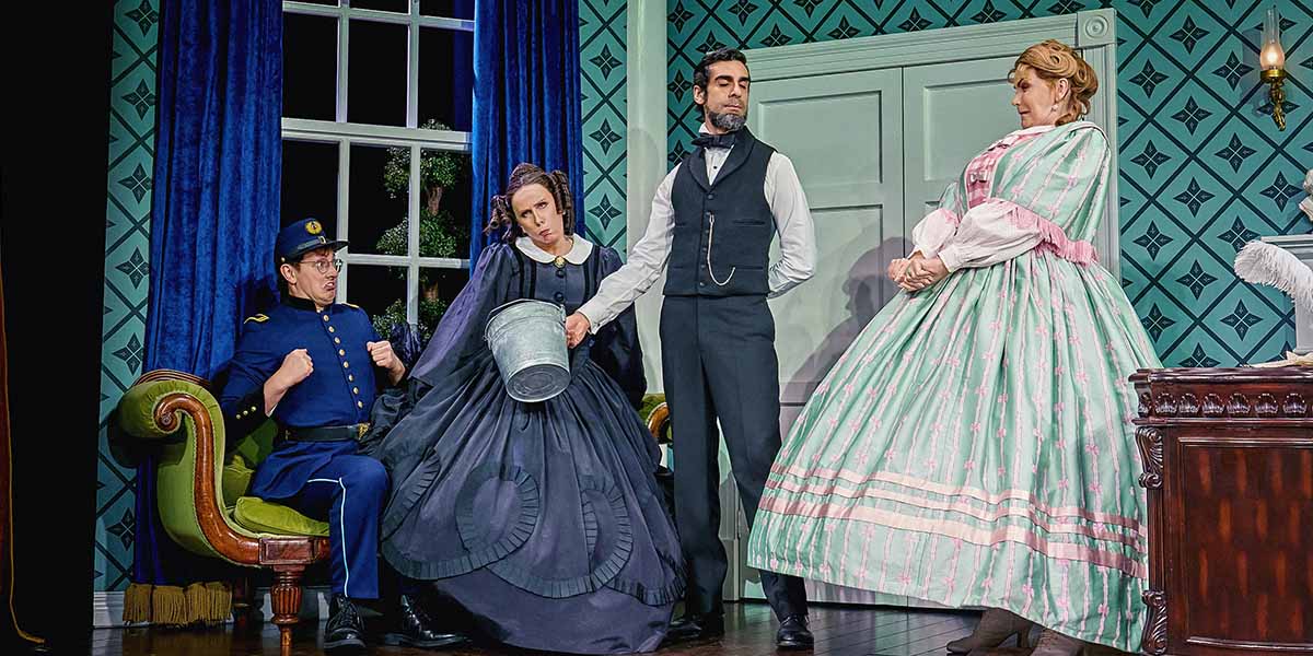 Three people are performing a comical scene.