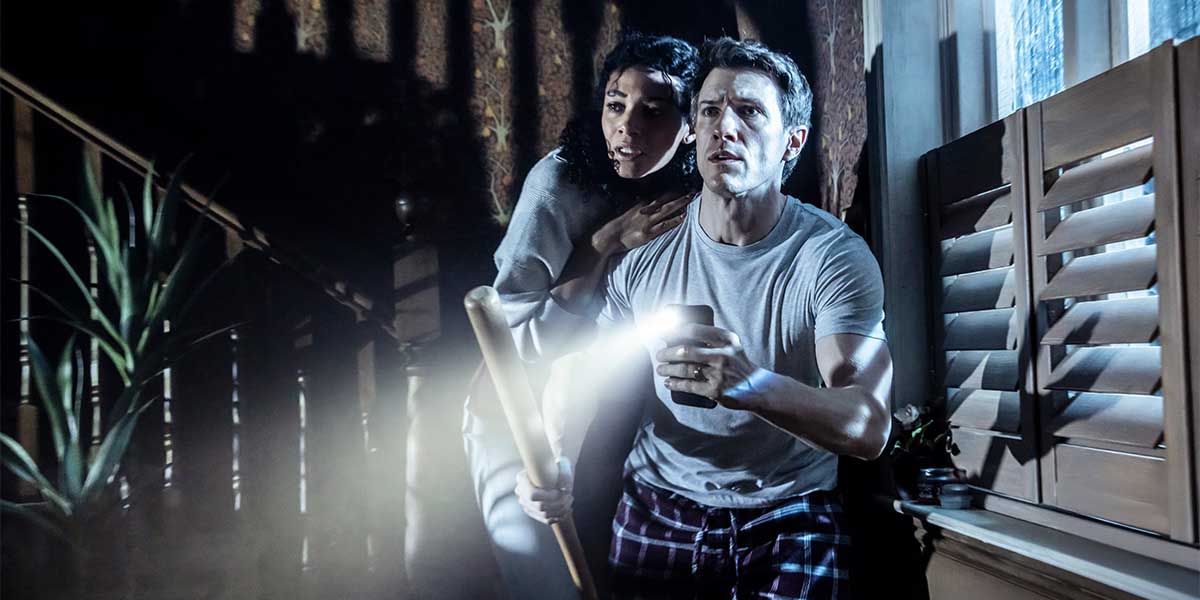 A dark, eerie scene featuring a shadowy figure in a dimly lit room, with unsettling shadows.