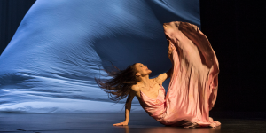 Dancers perform 'Sweet Mambo' by Pina Bausch, showcasing vibrant costumes and expressive movements on stage.