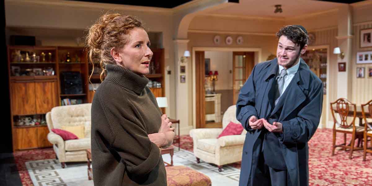 Dorothea Myer-Bennett and Alex Zur perform in a living room set, expressing intense emotions.