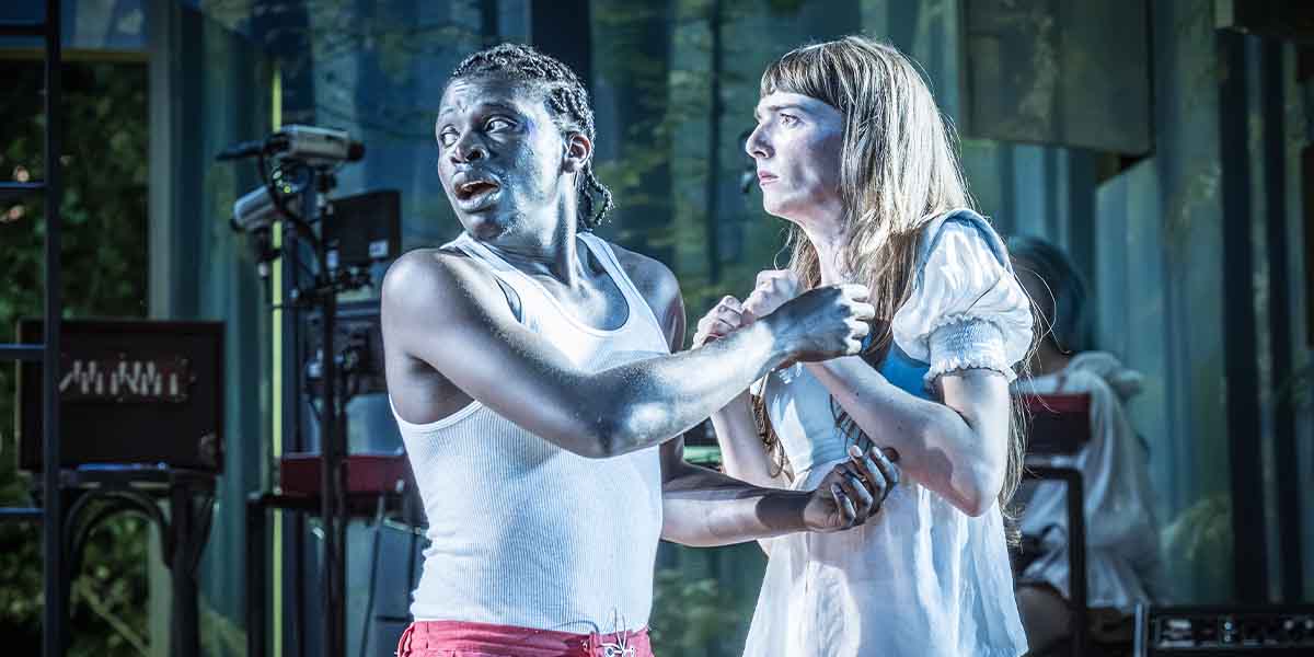 Terique Jarrett as Demetrius and Mary Malone as Helena, expressing tension in a theatrical scene.