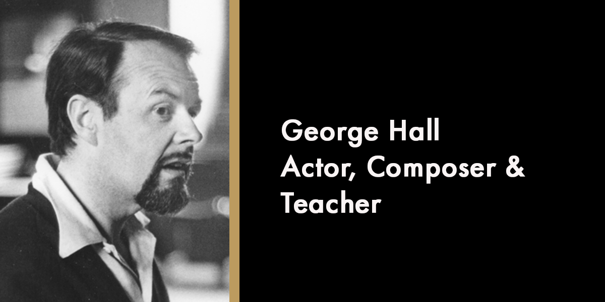 A tribute display featuring a framed photo of George Hall with flowers and candles surrounding it.