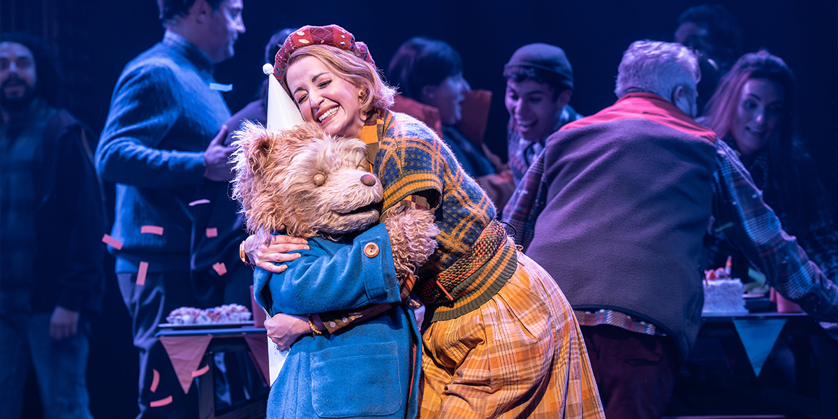 Gabriella Slade and Tahra Zafar pose together, smiling, in front of a backdrop for Best Costume Design.