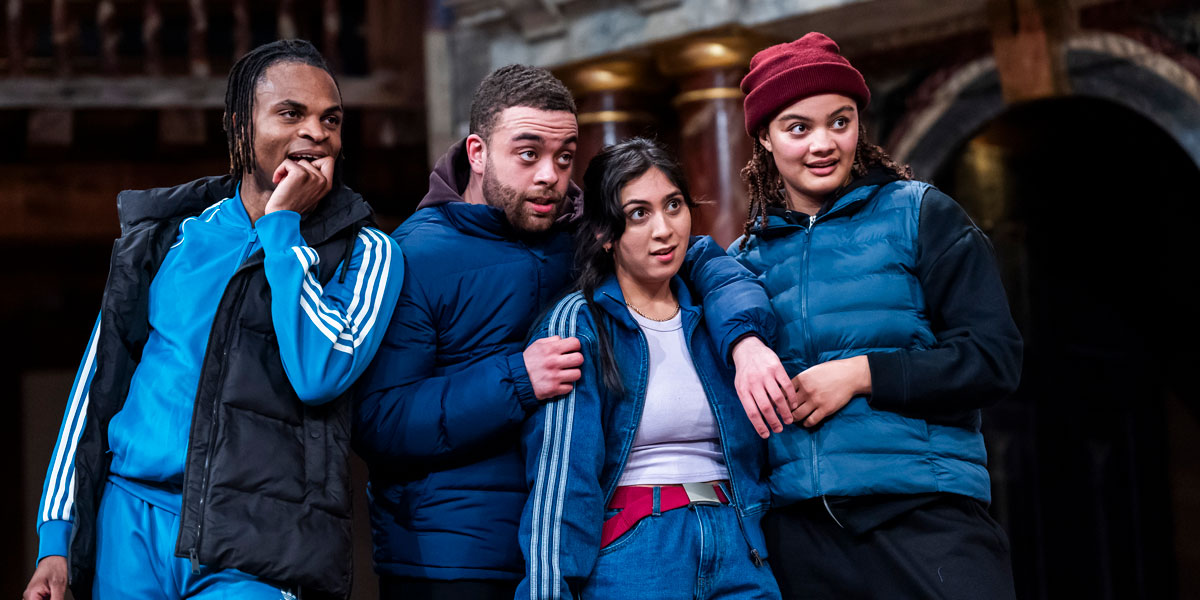 Actors perform a scene from Romeo and Juliet at Shakespeare's Globe, surrounded by a vibrant audience.