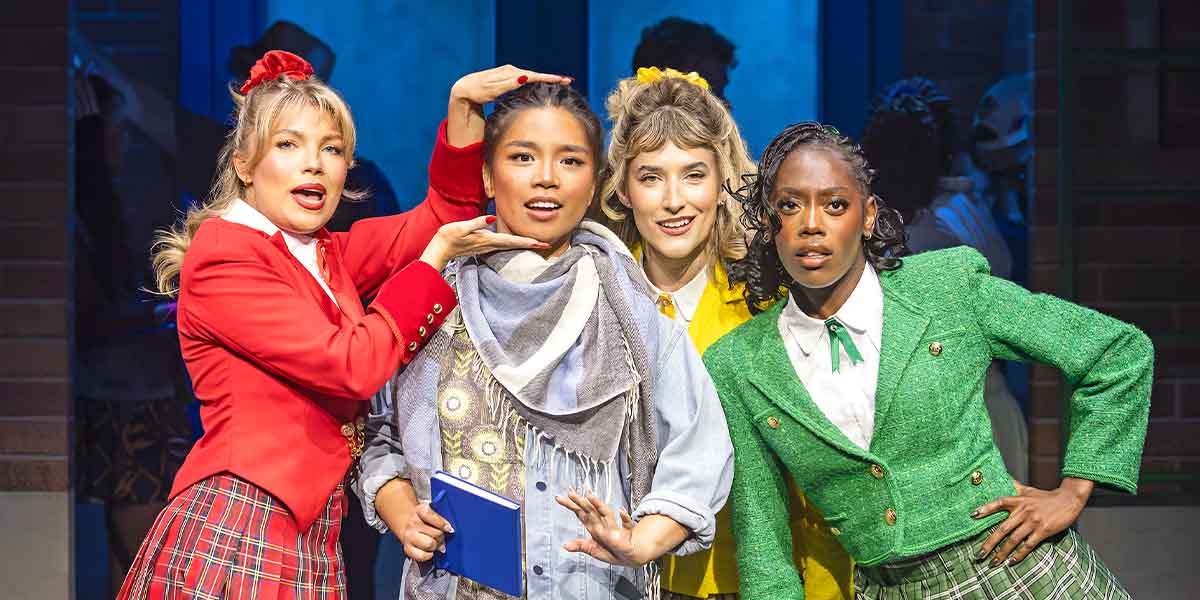 Liberty Stottor, Gerardine Sacdalan, Lou Henry, and Jessica Ibadin pose together in vibrant costumes.