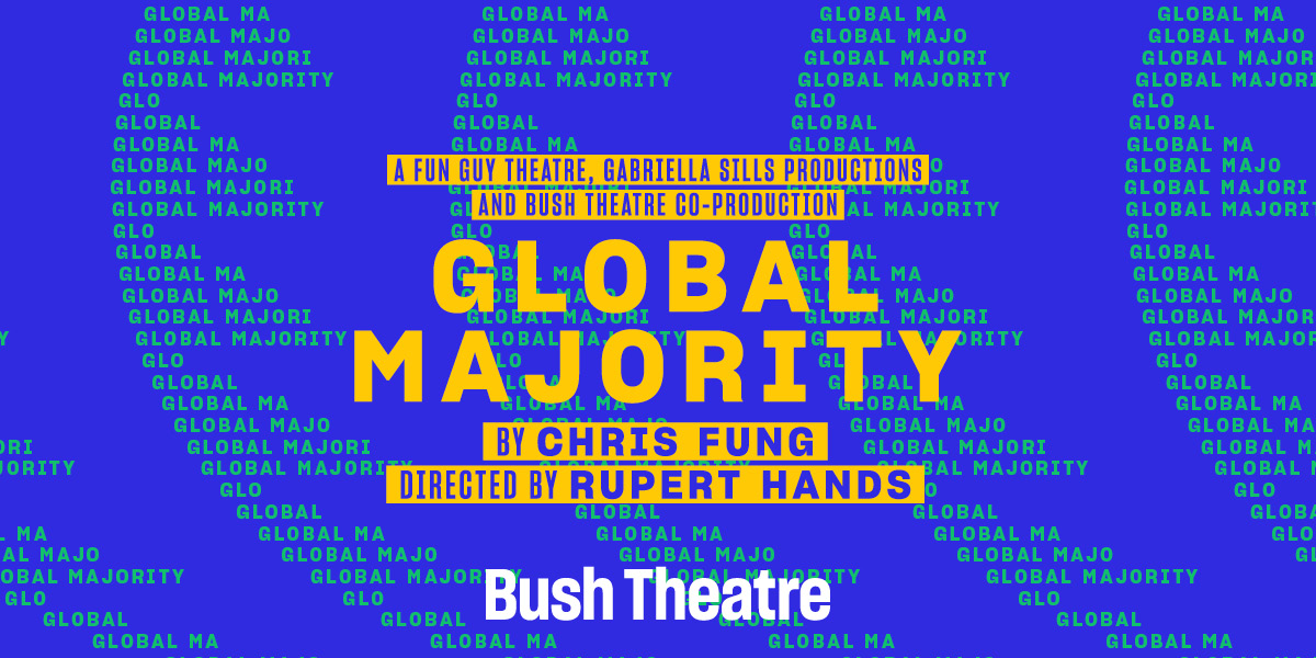 A ticket agent stands at a counter, smiling, with a backdrop of the Bush Theatre's logo.