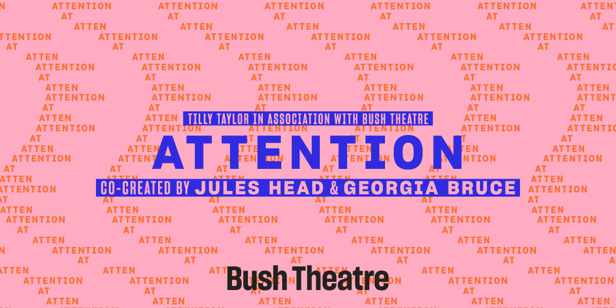 A ticket agent stands behind a counter, attentively assisting a customer in a theatre setting.